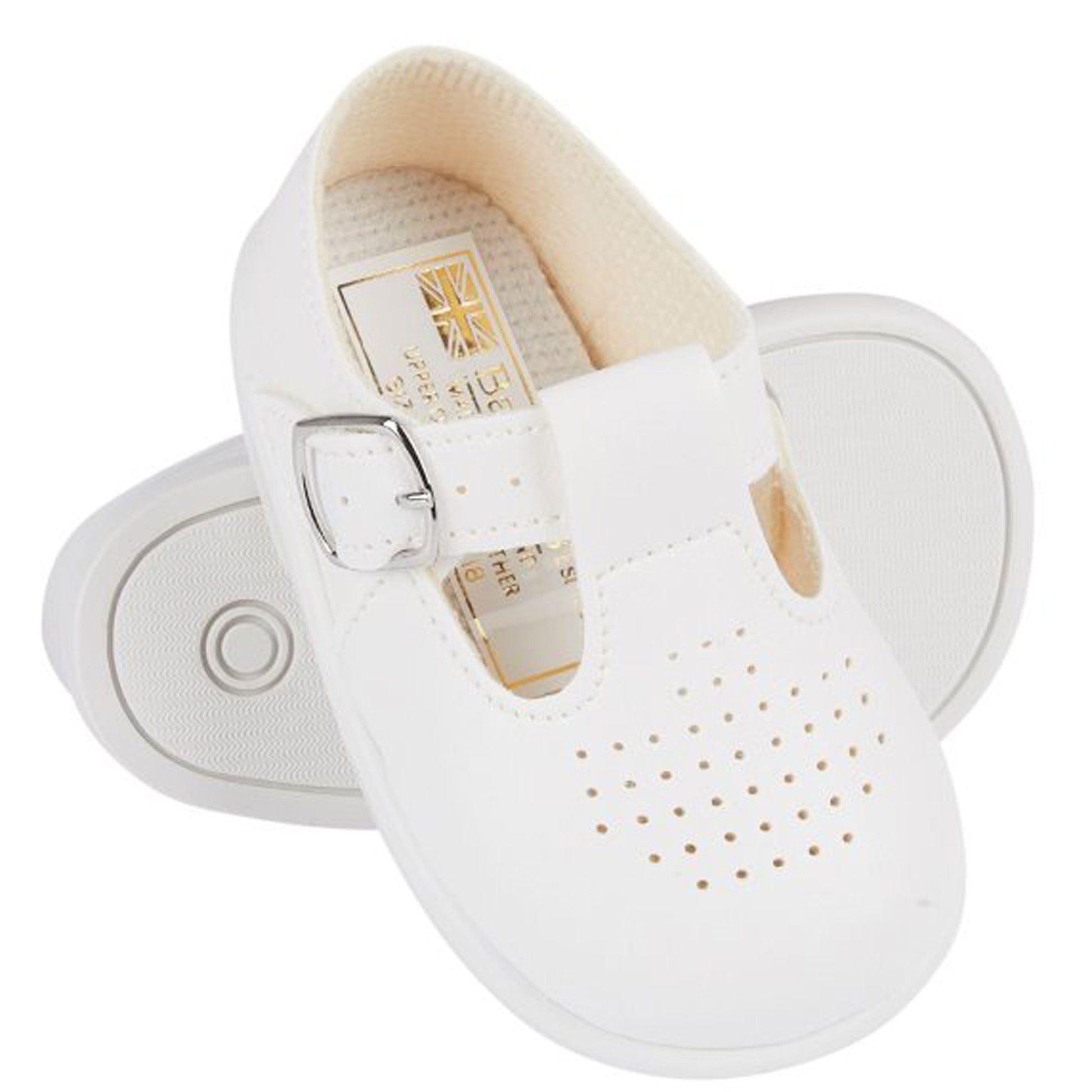 White baby shoes with a buckle on a white background