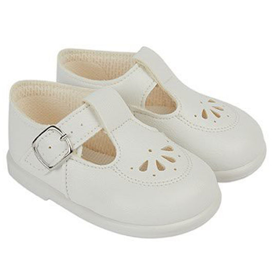 Pair of white children's shoes with a buckle on a white background