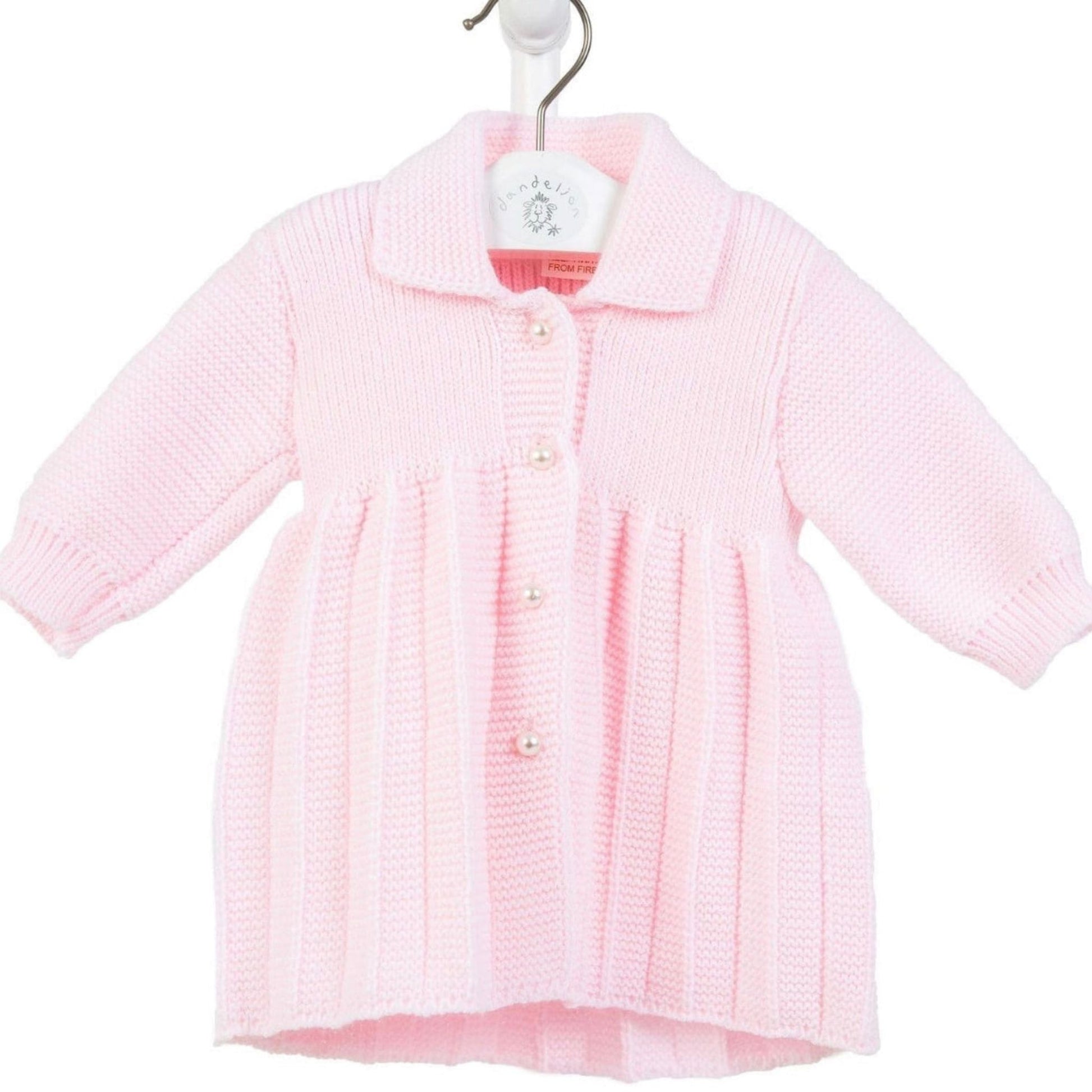 Pink baby cardigan on a white background