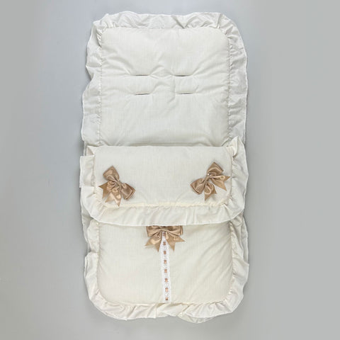 cream footmuff with three beige bows