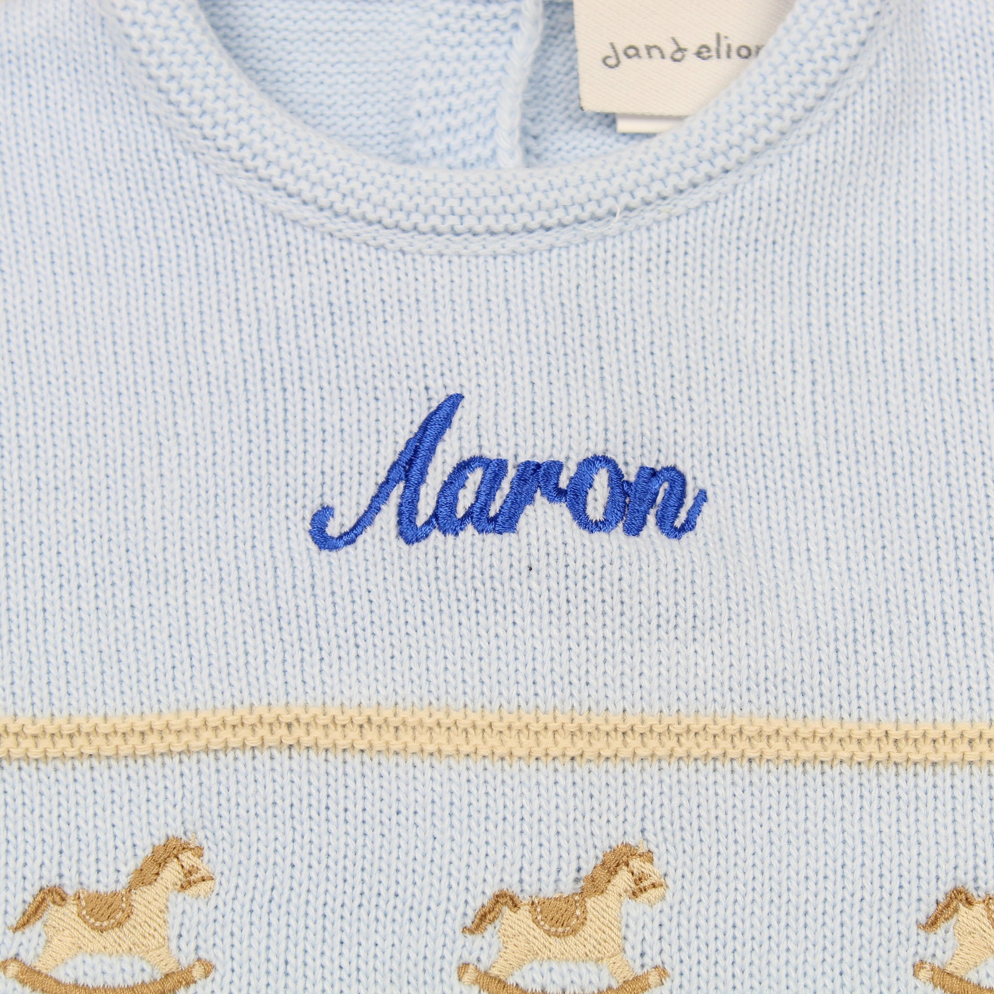 baby boys knitted all in one personalised outfit rocking horse