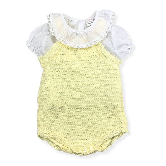 Yellow baby romper with white ruffled top on a white background
