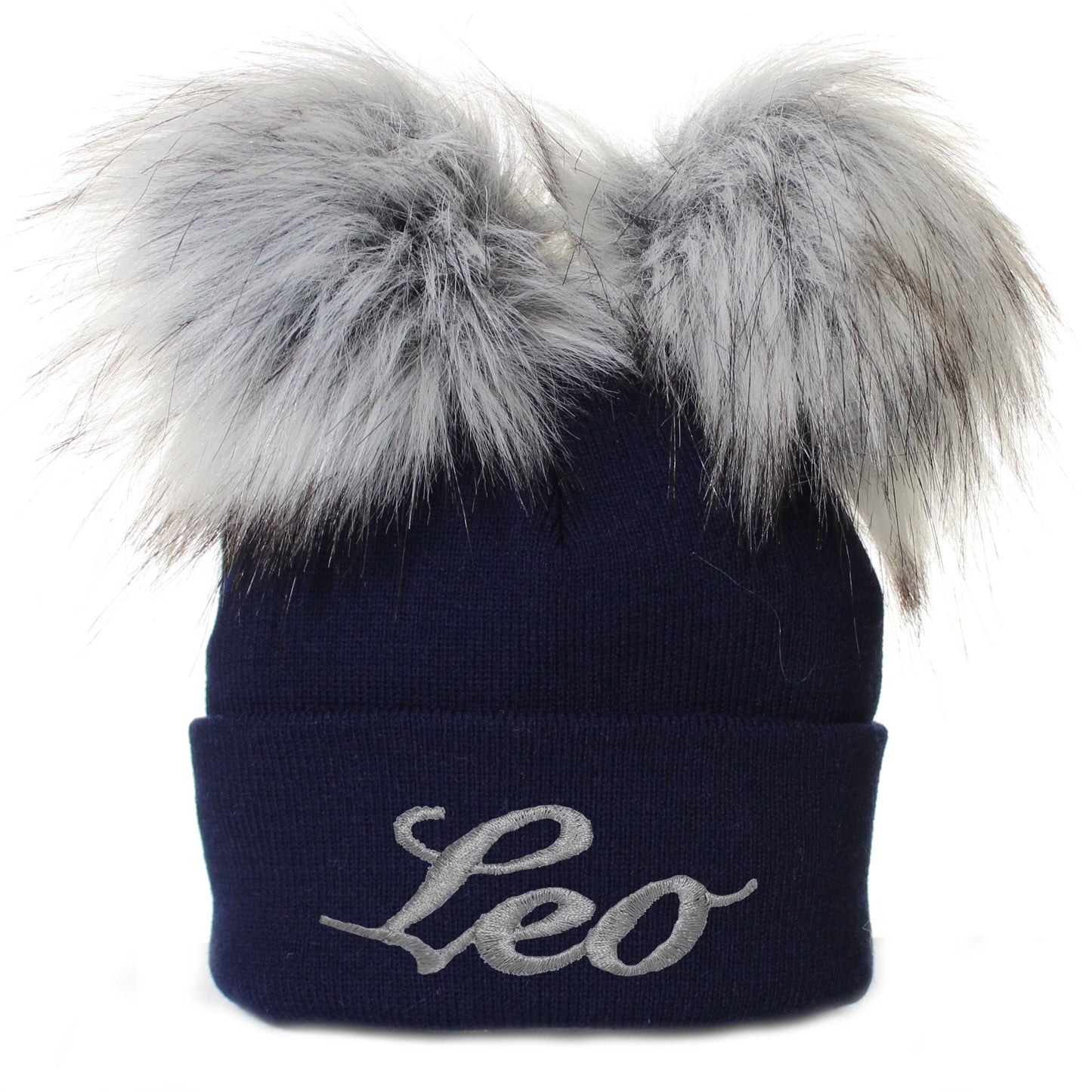 Navy blue beanie with gray fur pom-poms and 'Leo' embroidery on a white background