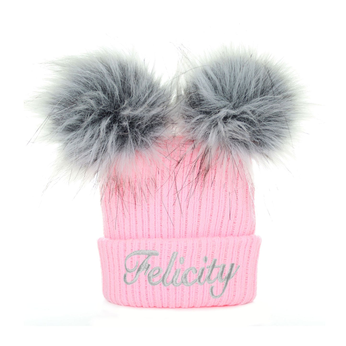 Pink beanie with gray fur pom-poms and 'Felicity' embroidery on a white background