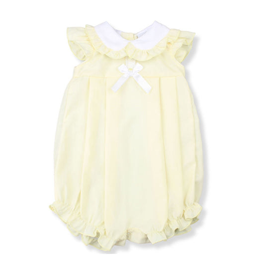 Yellow baby romper with white collar and bow on a white background