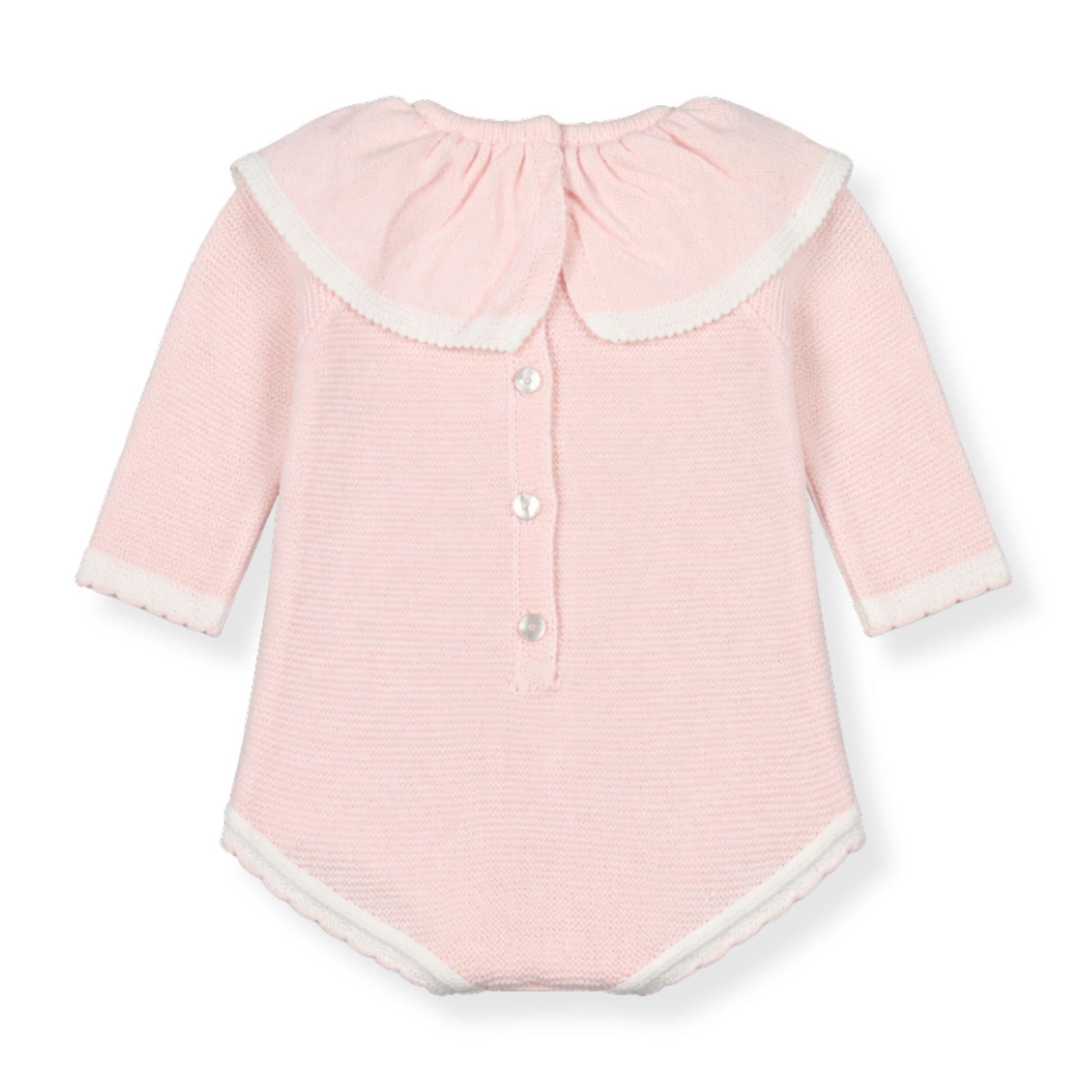 Pink baby romper with white buttons on a white background