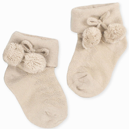 beige ankle pom socks for a baby