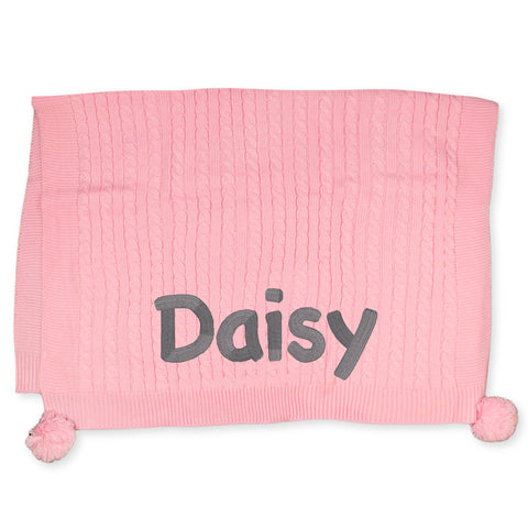 knitted baby girls blanket with pom poms