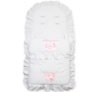 white personalised footmuff cosytoes with pink bows for a baby girl