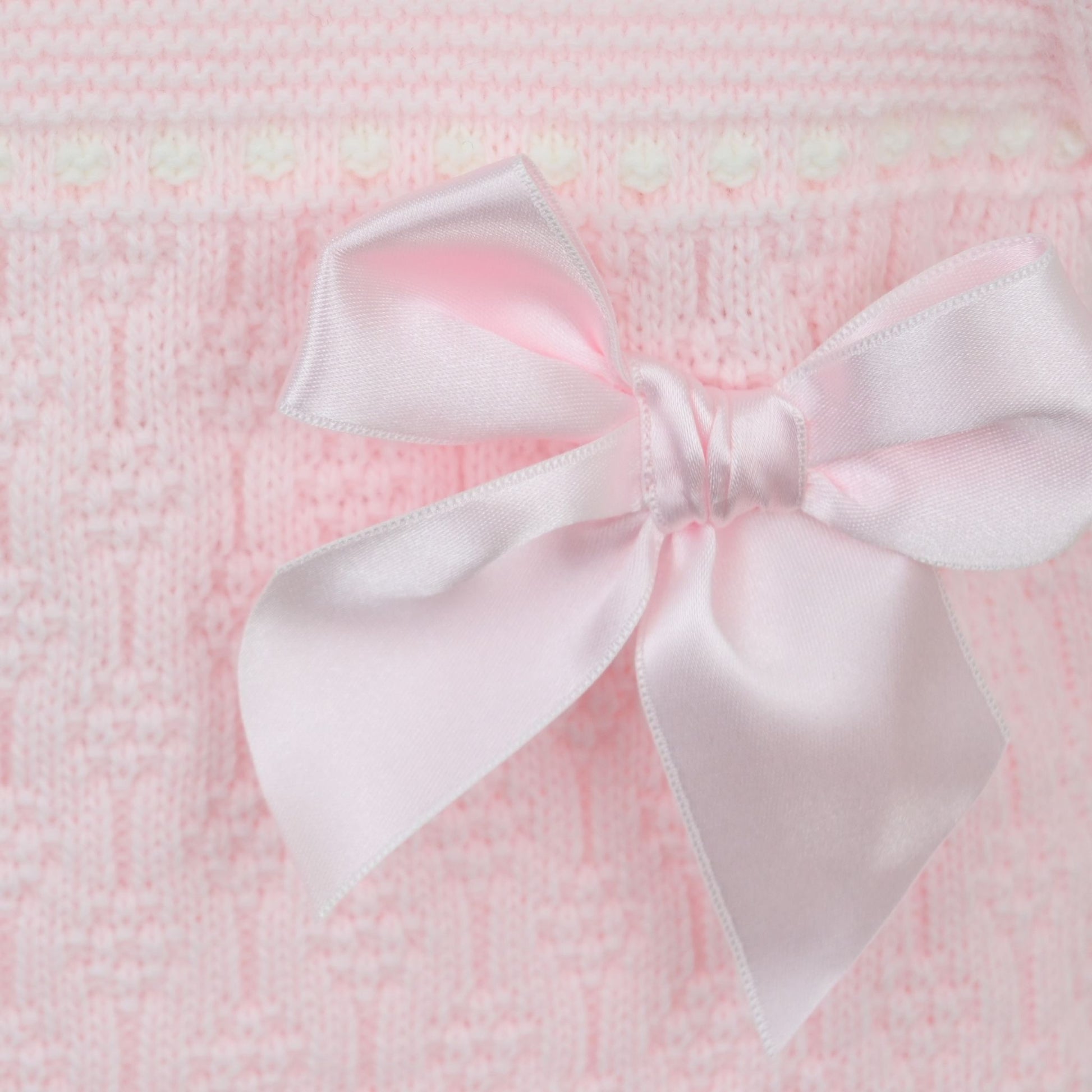 Pink baby outfit with a bow