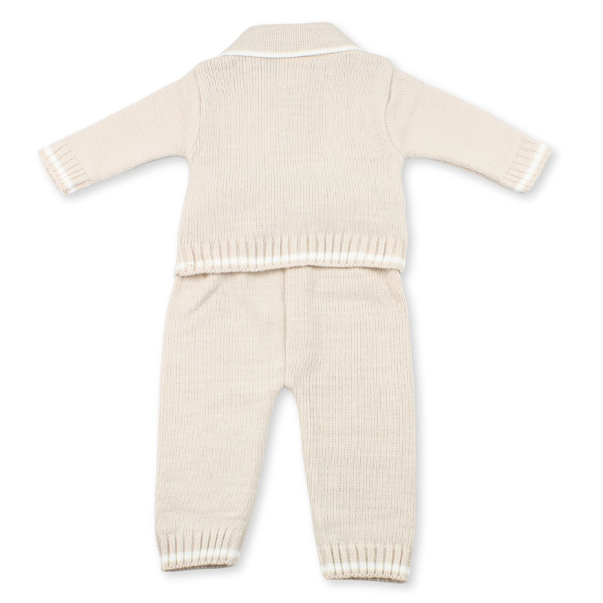 Knitted baby outfit with sweater and pants on a white background