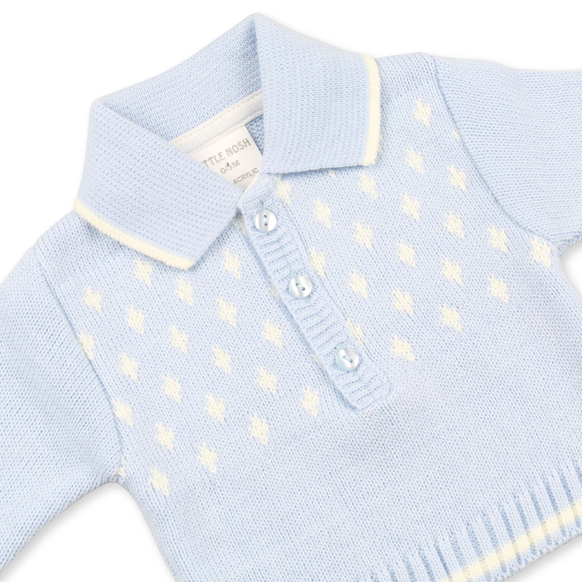 Light blue knitted sweater with white pattern on a white background