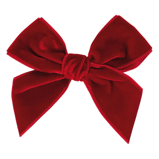 Red velvet bow on a white background