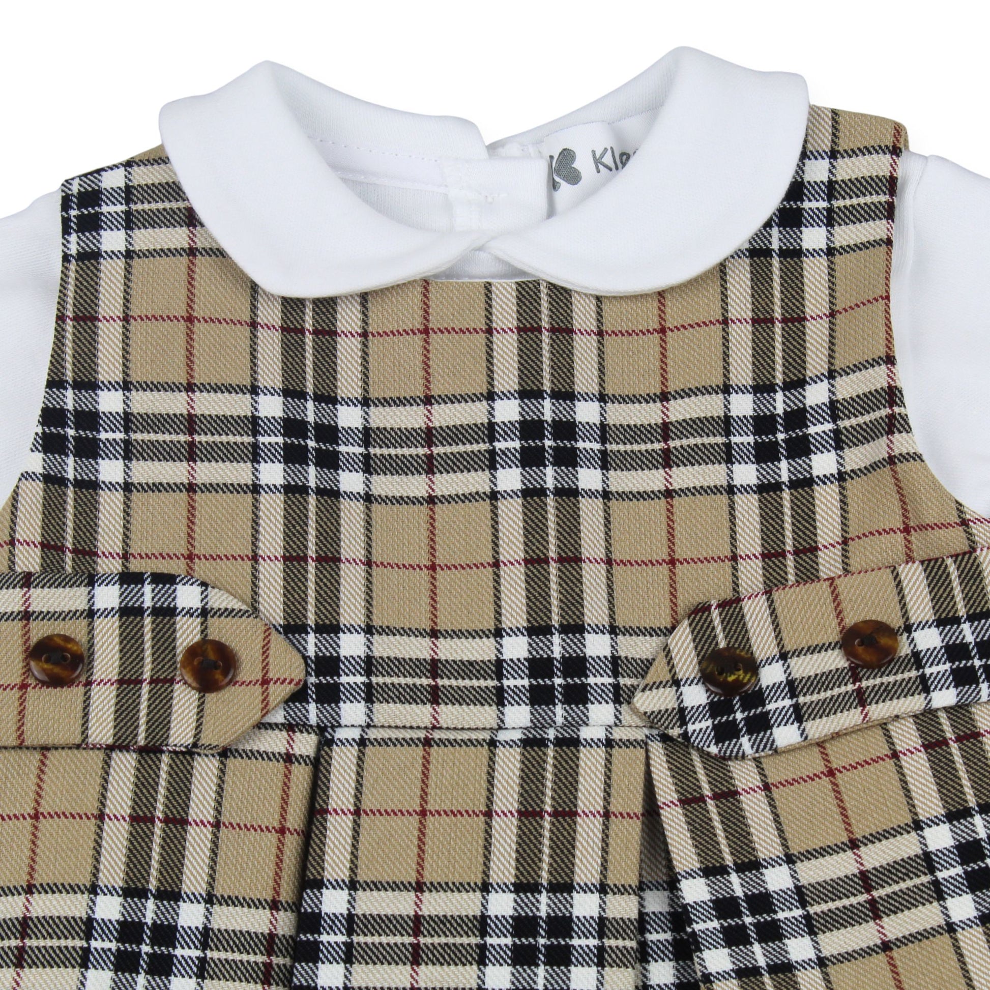 Plaid patterned garment with a white collar and brown buttons on a white background