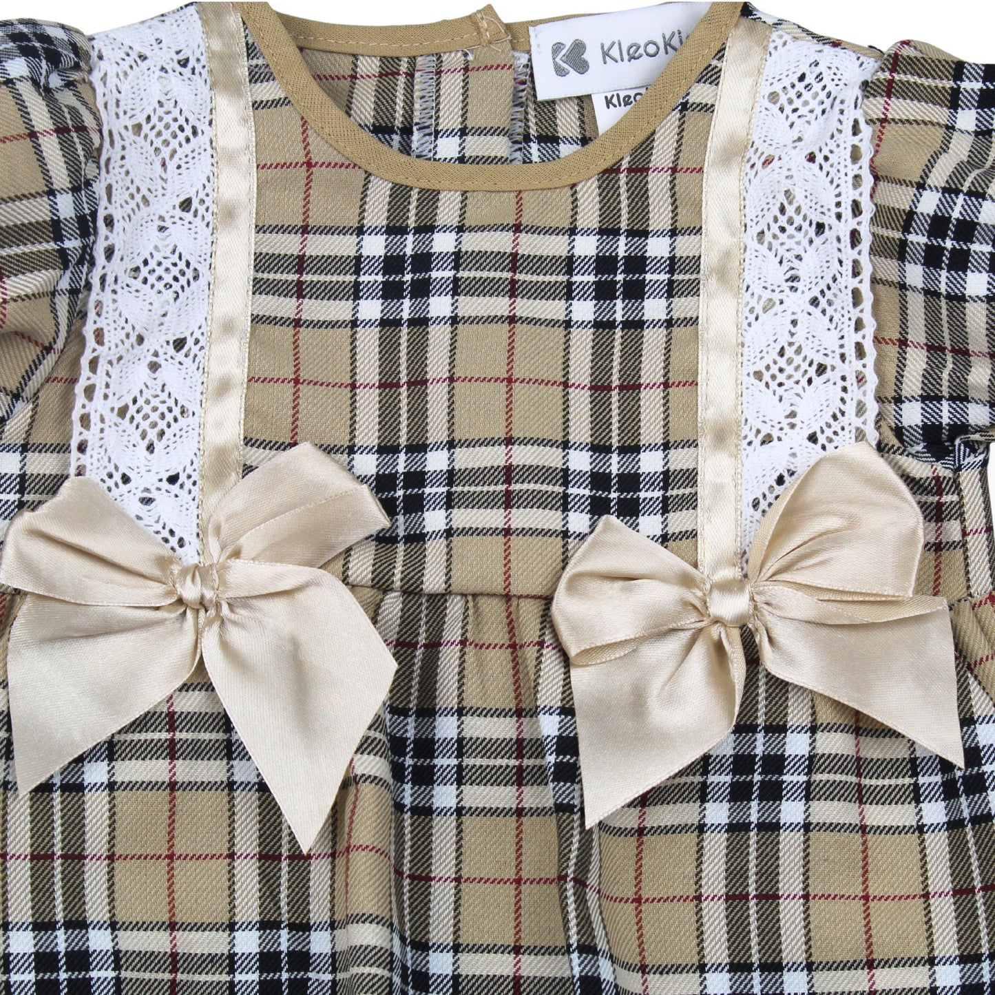 Plaid dress with lace details and bows