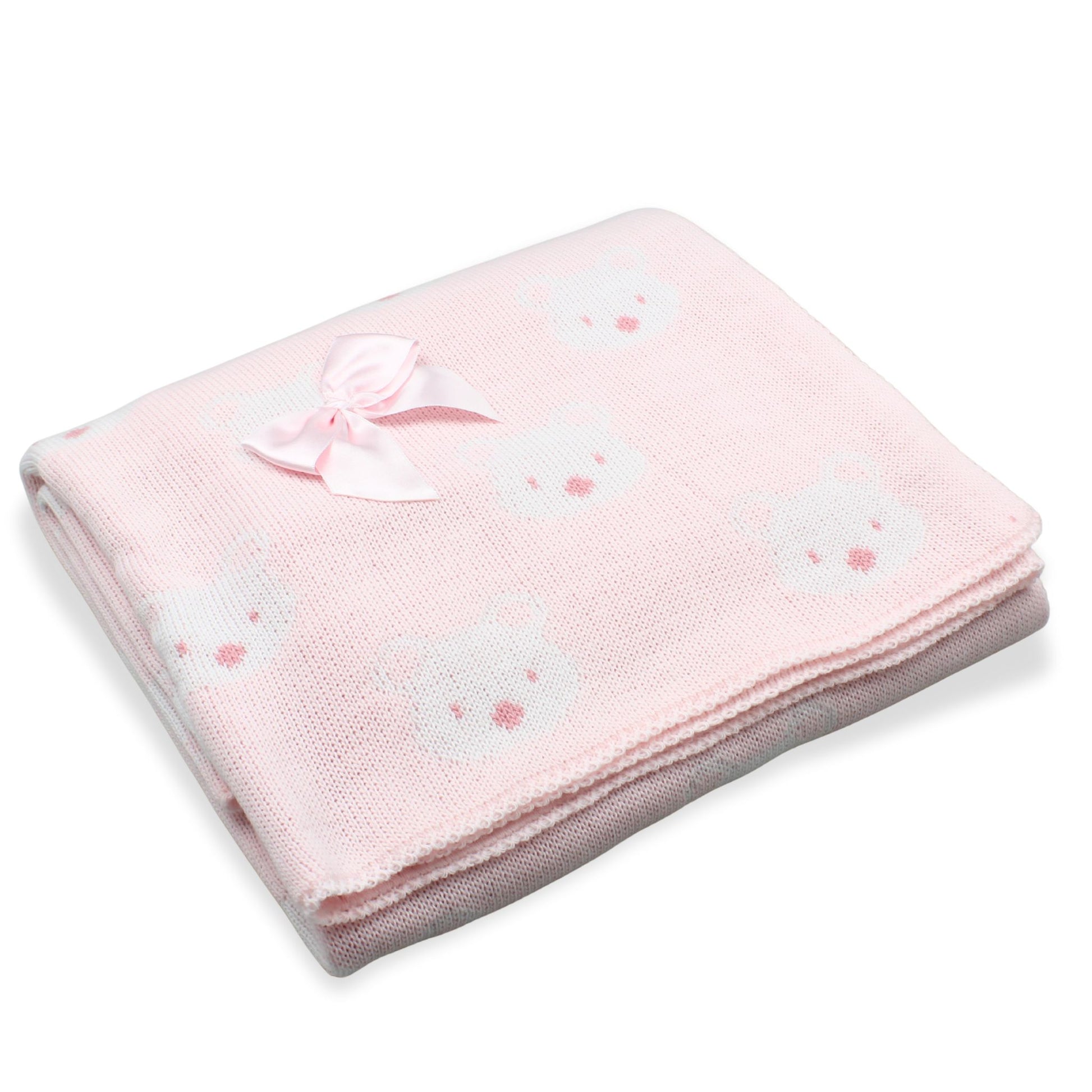 Pink baby blanket with bow and bear patterns on a white background