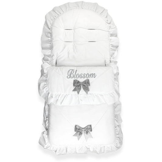White baby footmuff with gray bows and 'Blossom' text on a white background