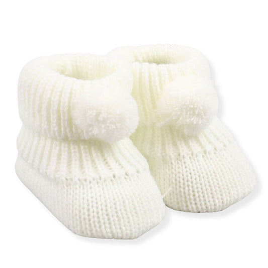 Pair of white baby booties on a white background