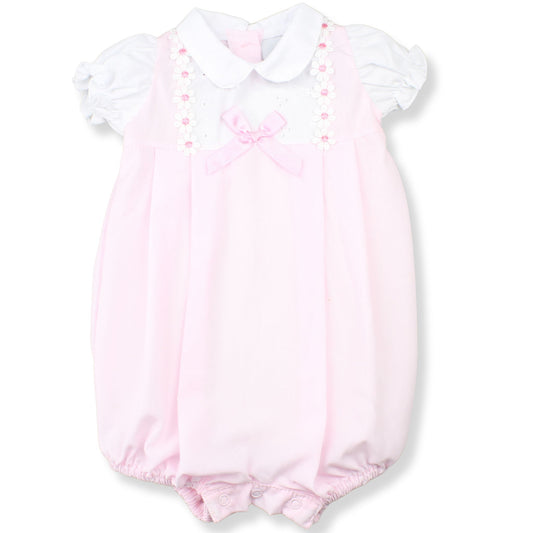 Pink baby romper with white collar on a white background