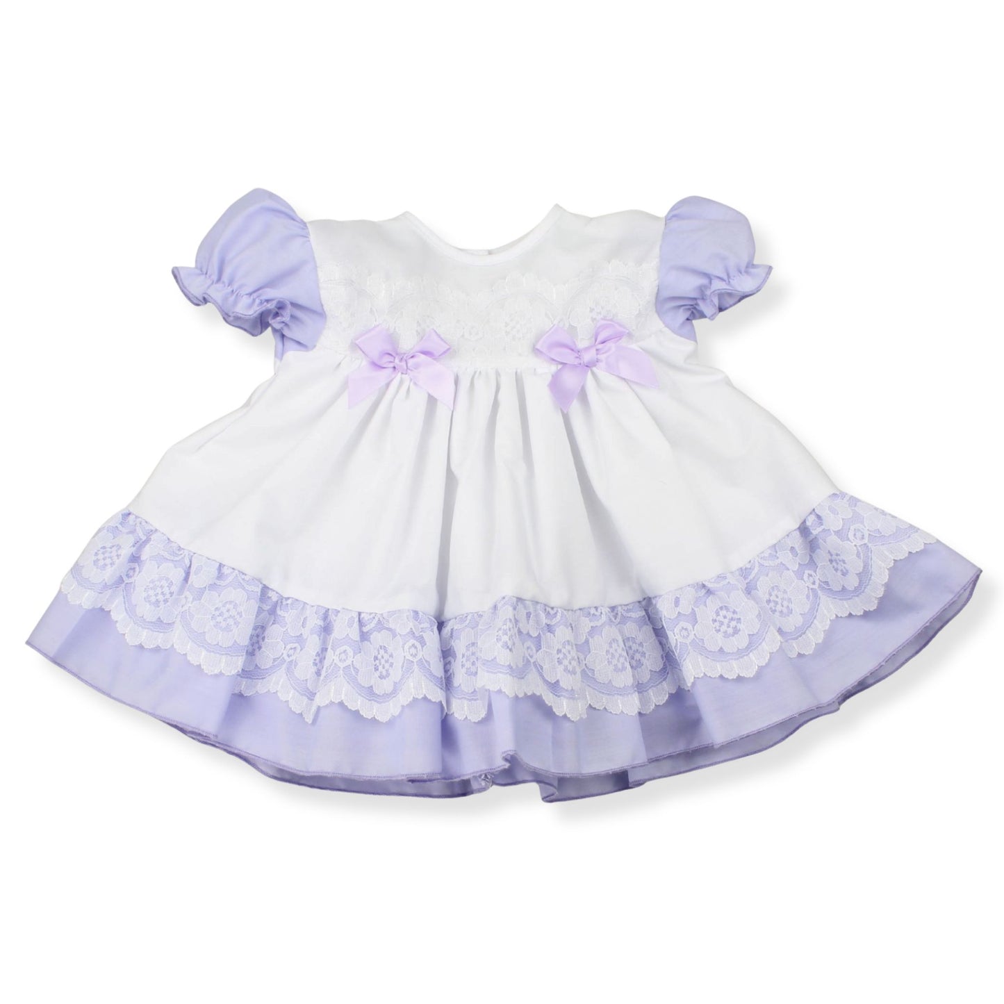 White dress with purple accents and lace details on a white background