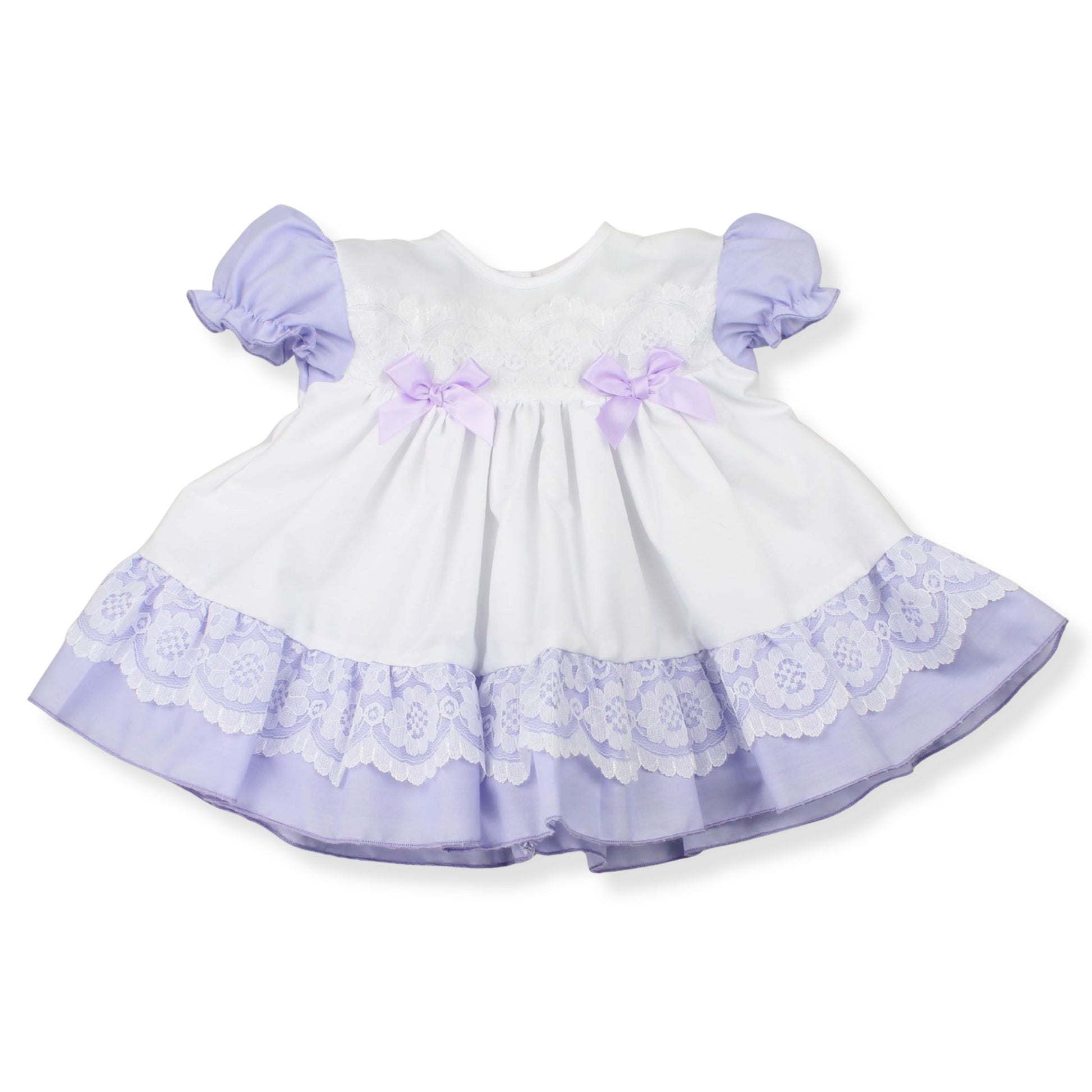 White dress with purple accents and lace details on a white background