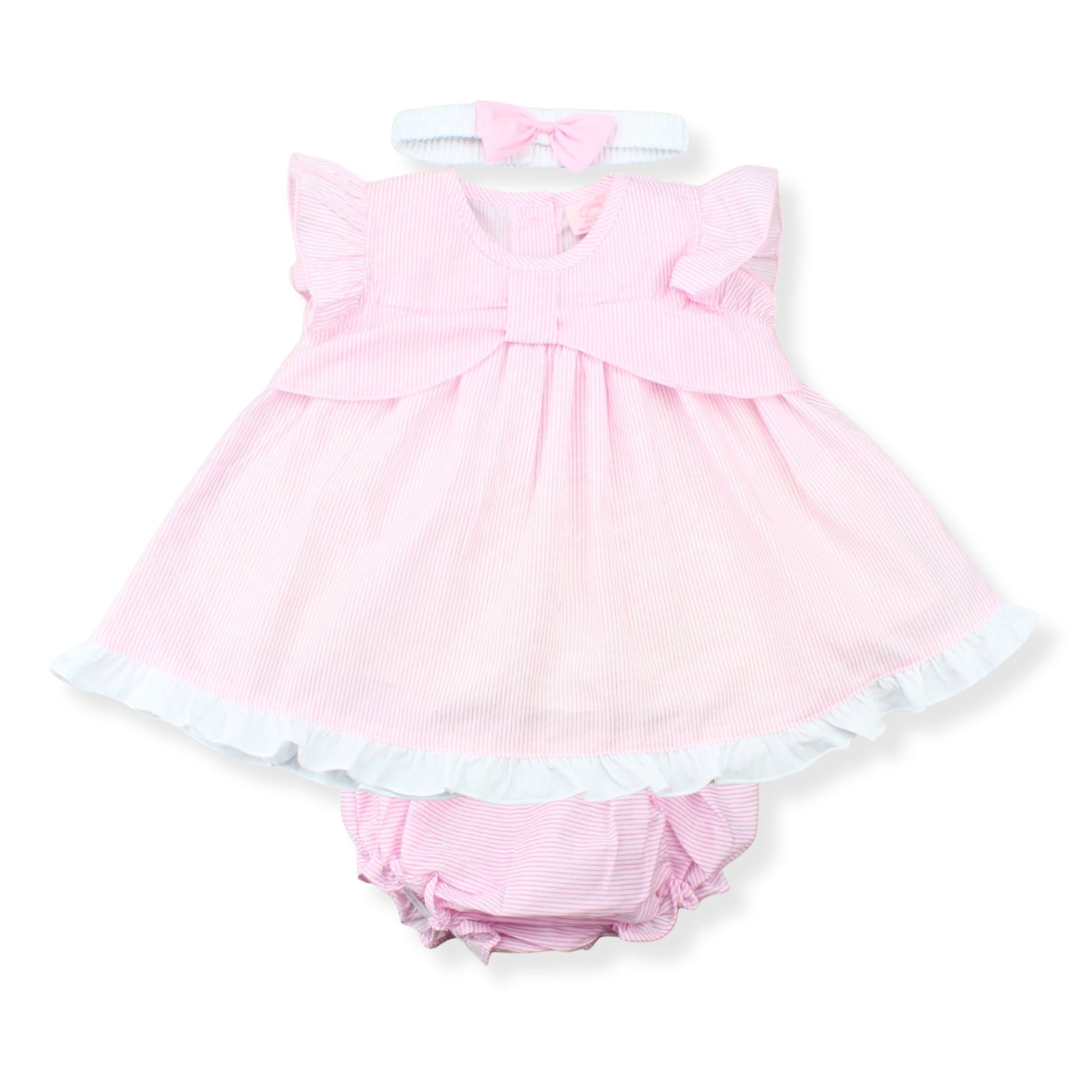 Pink baby dress with white trim on a white background