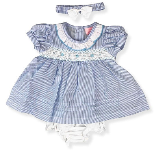 Baby dress with ruffled collar, matching headband, and bloomers on a white background