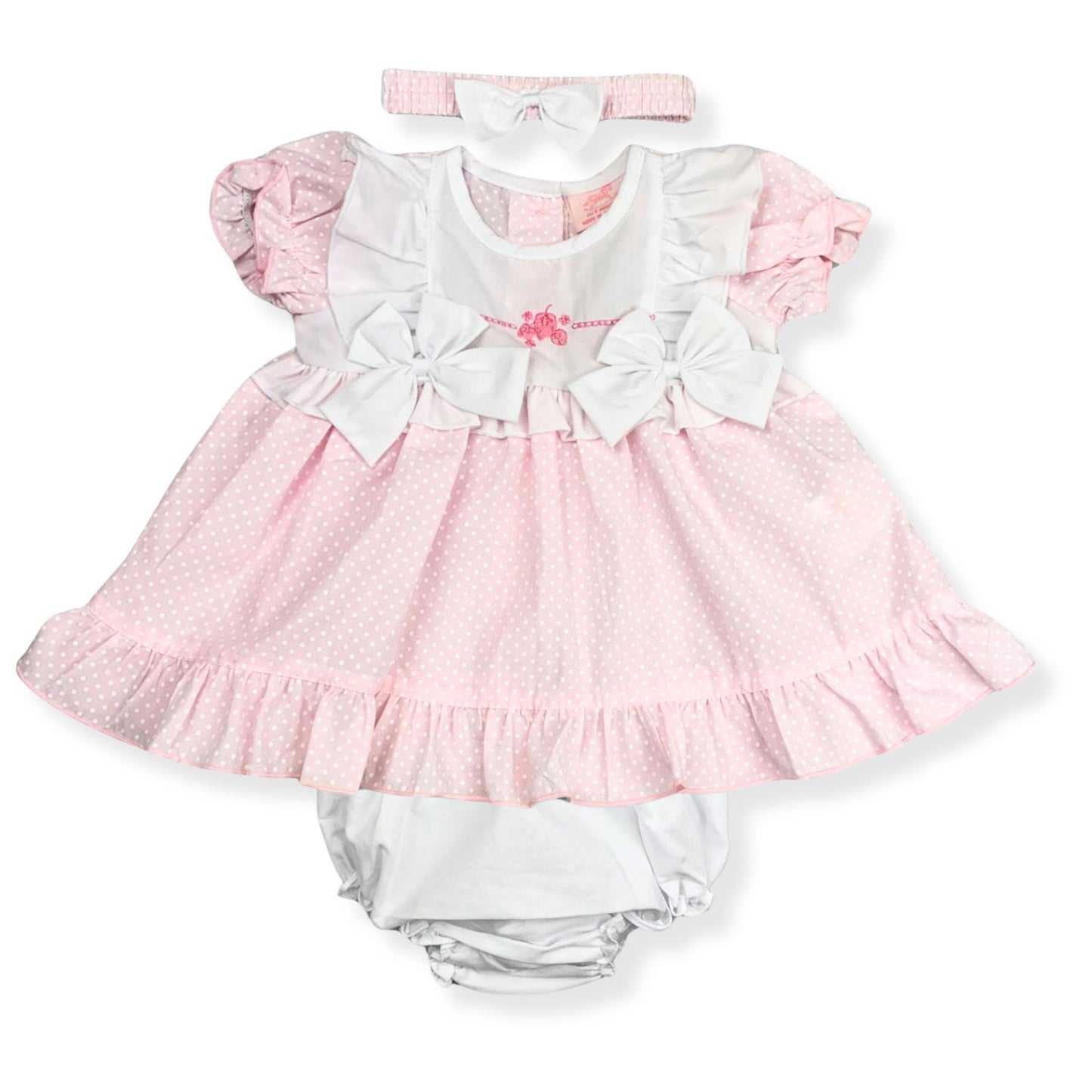 Baby girl's pink and white dress set with headband on a white background