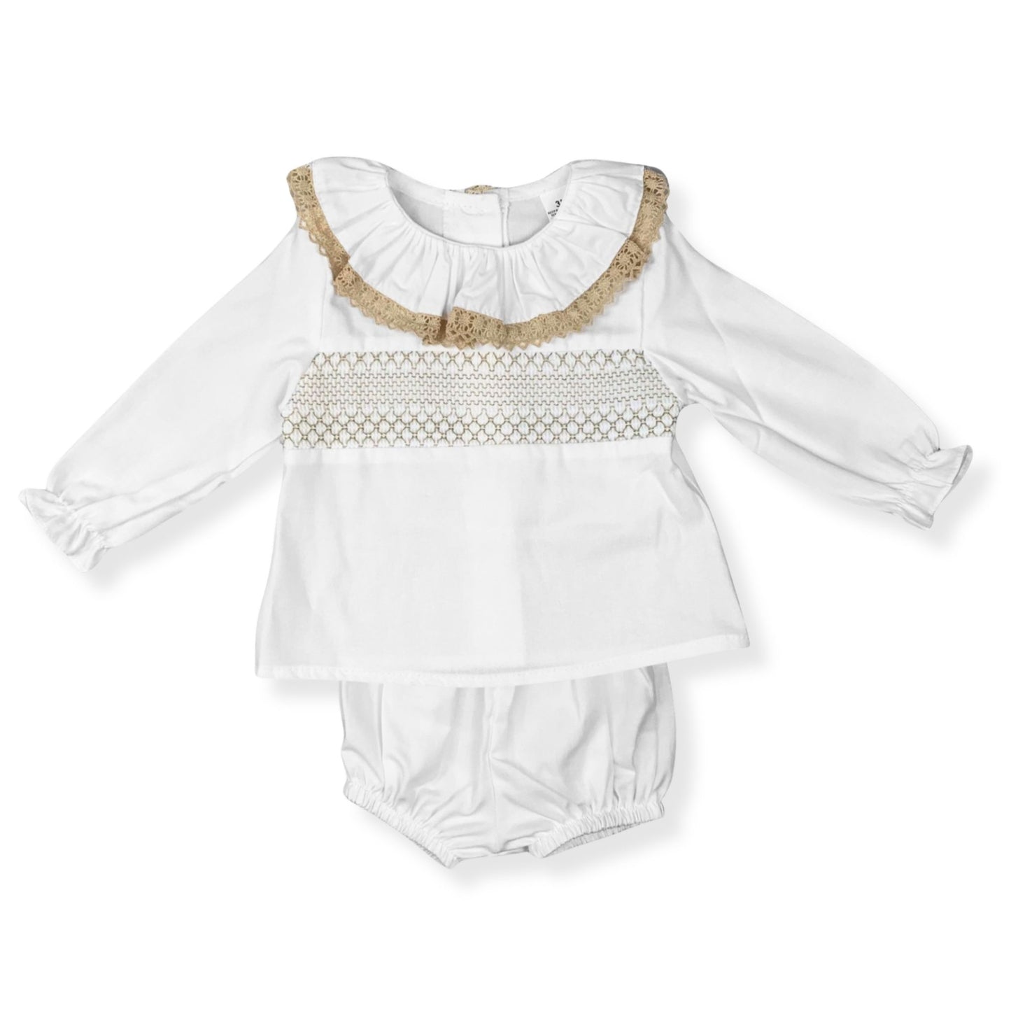 White baby outfit with ruffled collar and smocked bodice on a white background