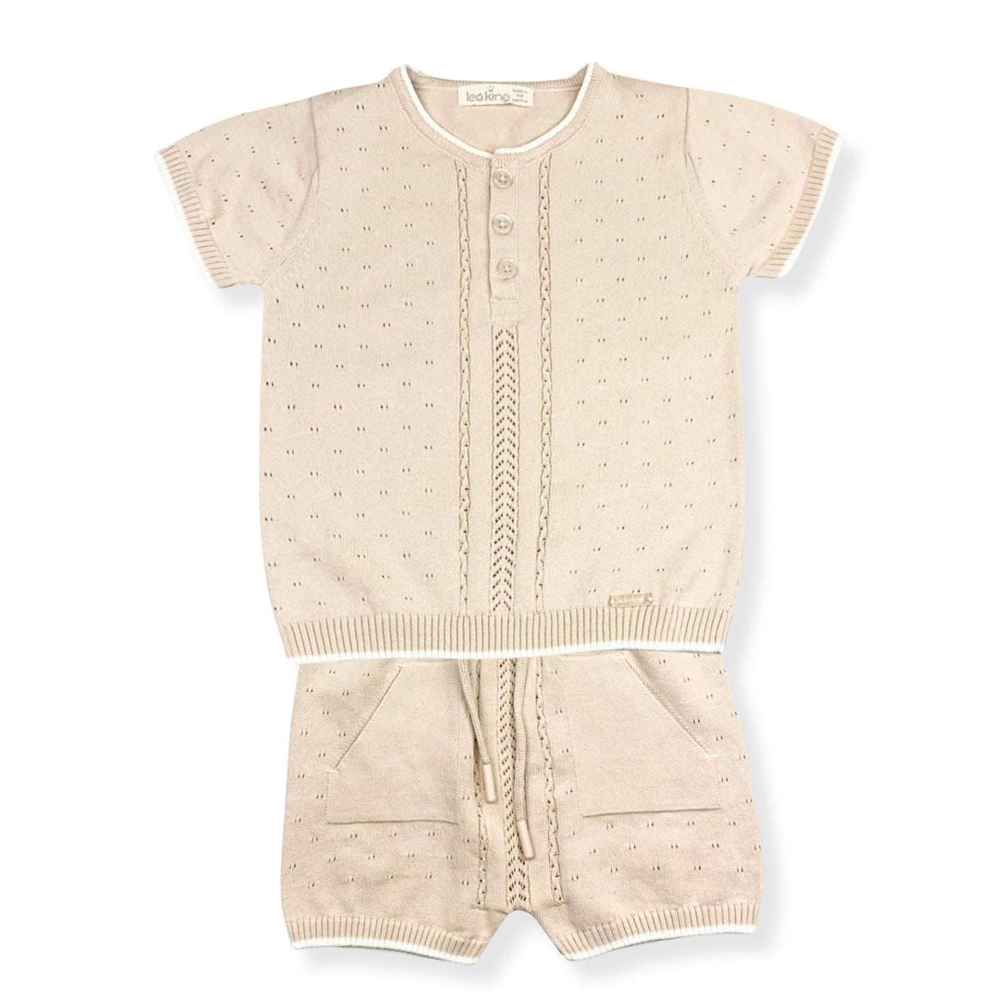 Beige baby outfit with short-sleeve top and shorts on a white background