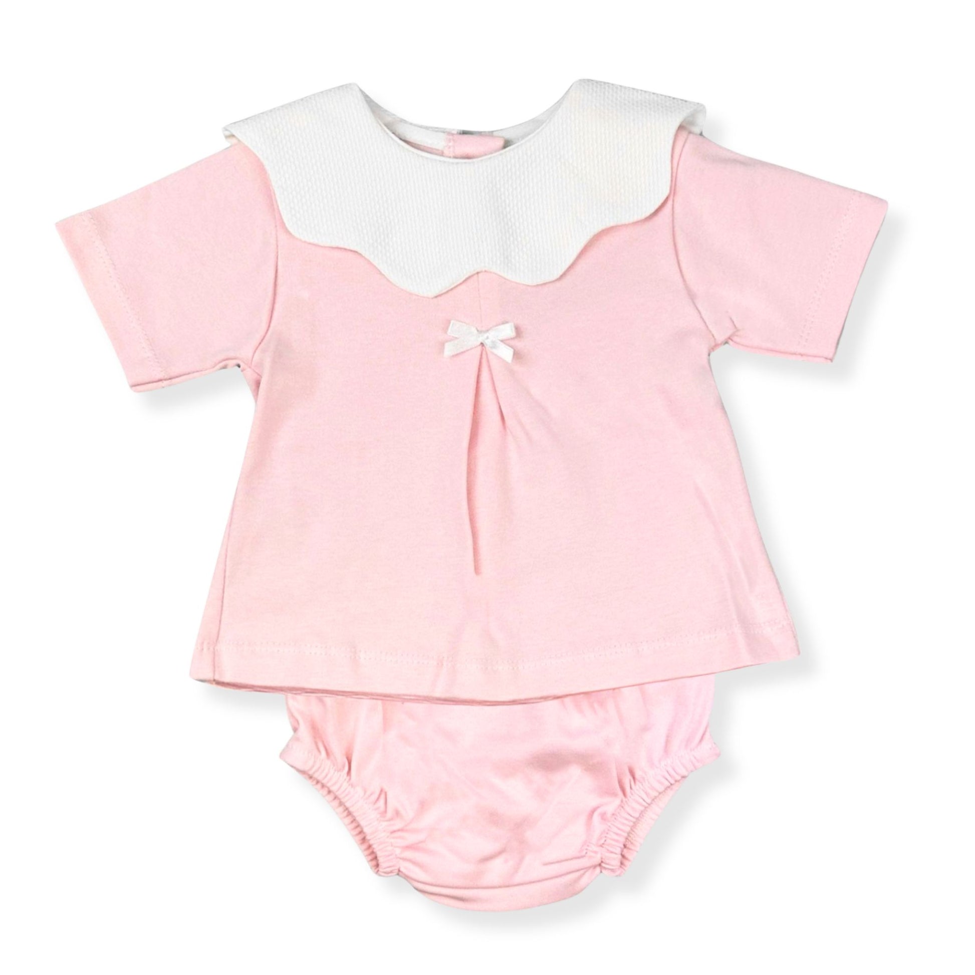 Pink baby outfit with white collar and bow on a white background