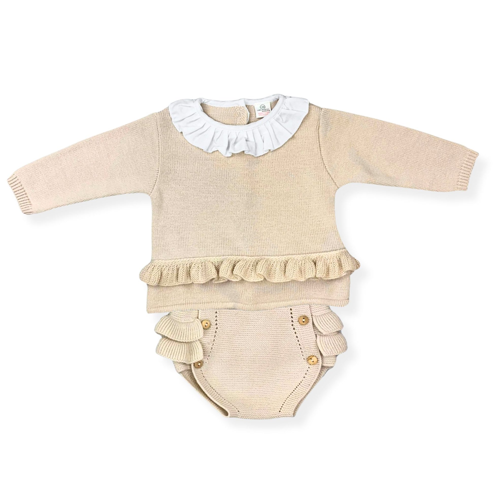 Beige baby outfit with ruffled details on a white background