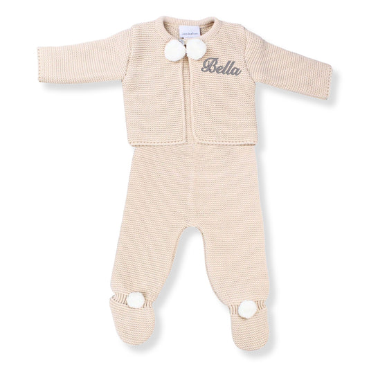 Beige baby outfit with a jacket and pants on a white background personalised