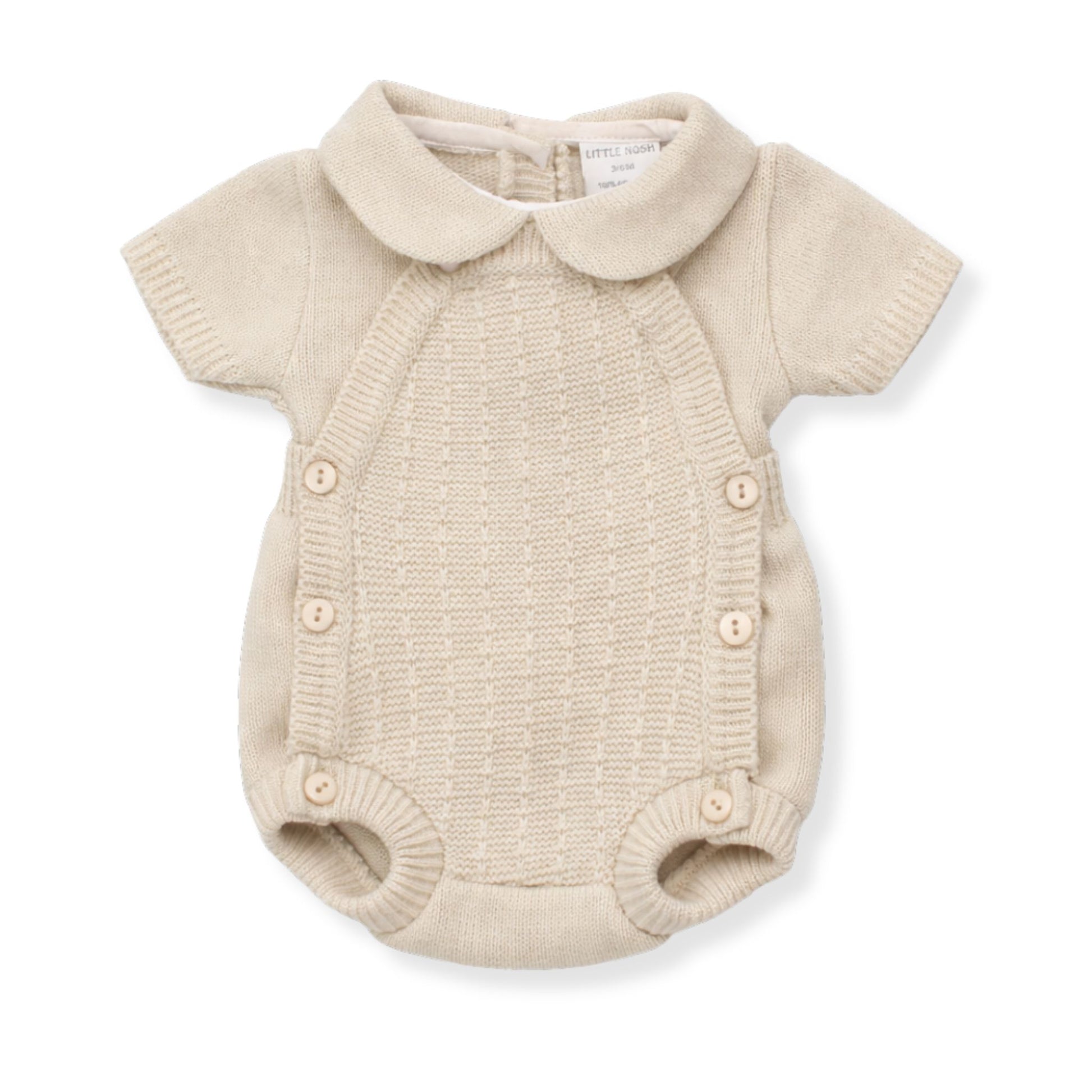 Beige knitted baby romper with collar on a white background