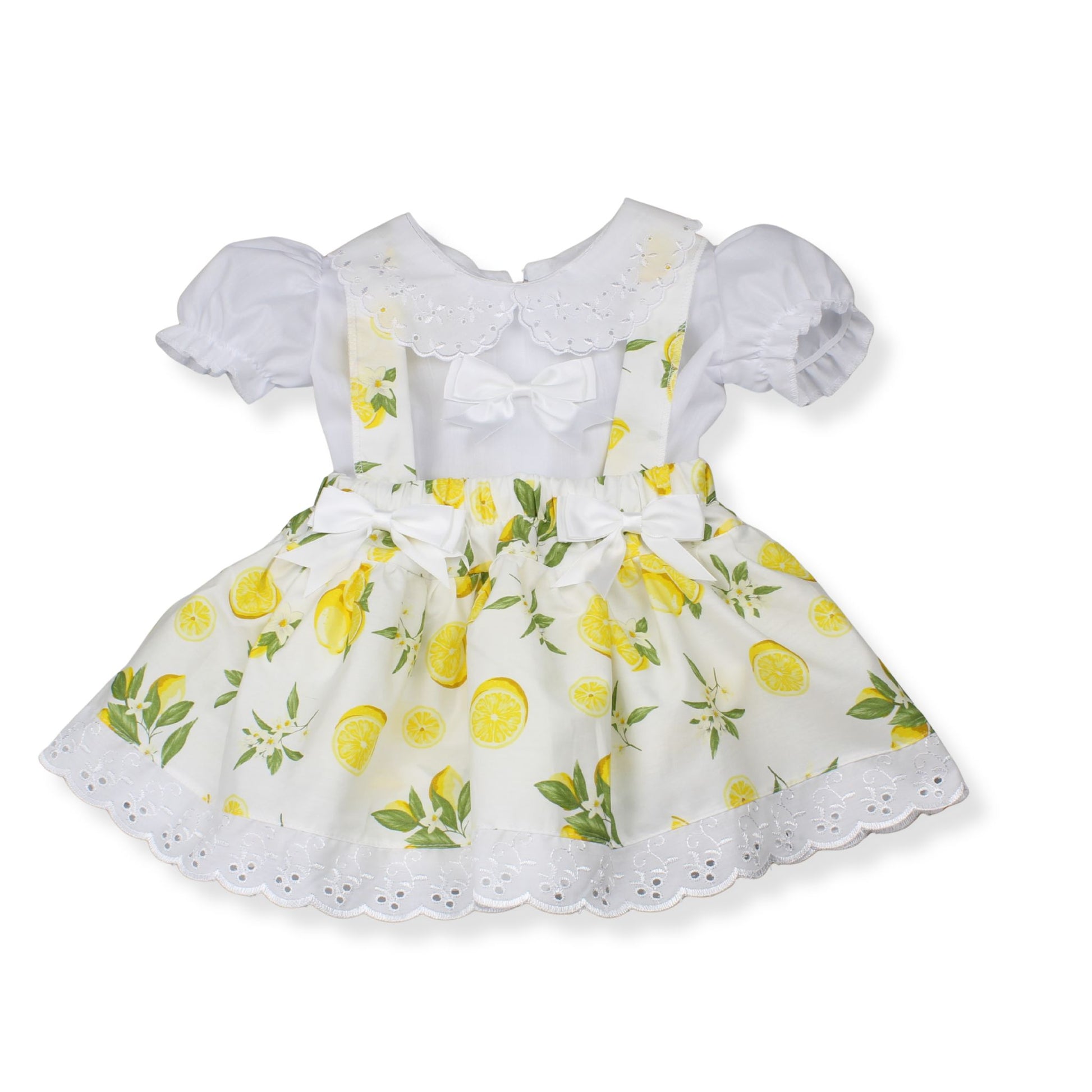 White dress with lemon pattern on a white background