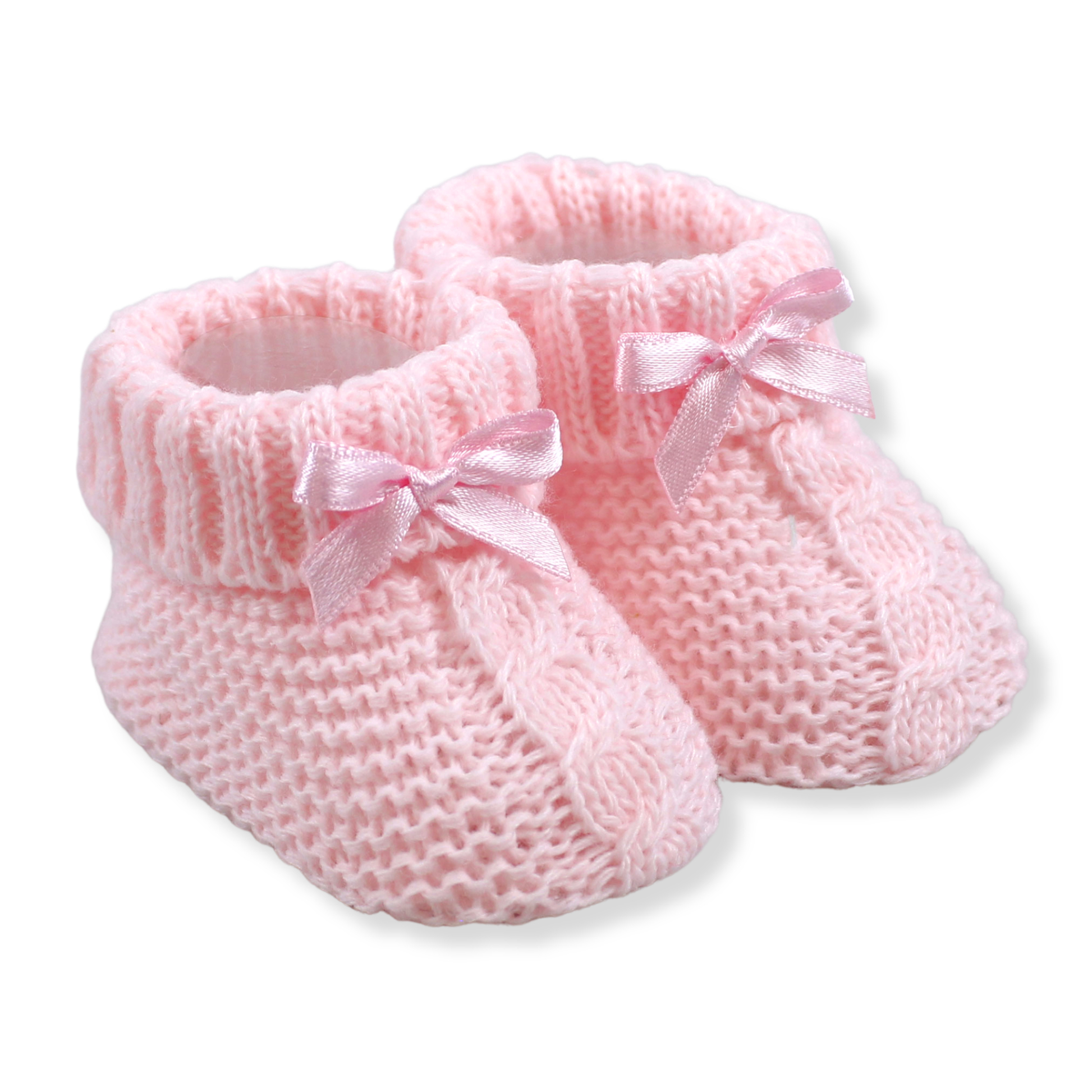 Pair of pink knitted baby booties with ribbons on a white background