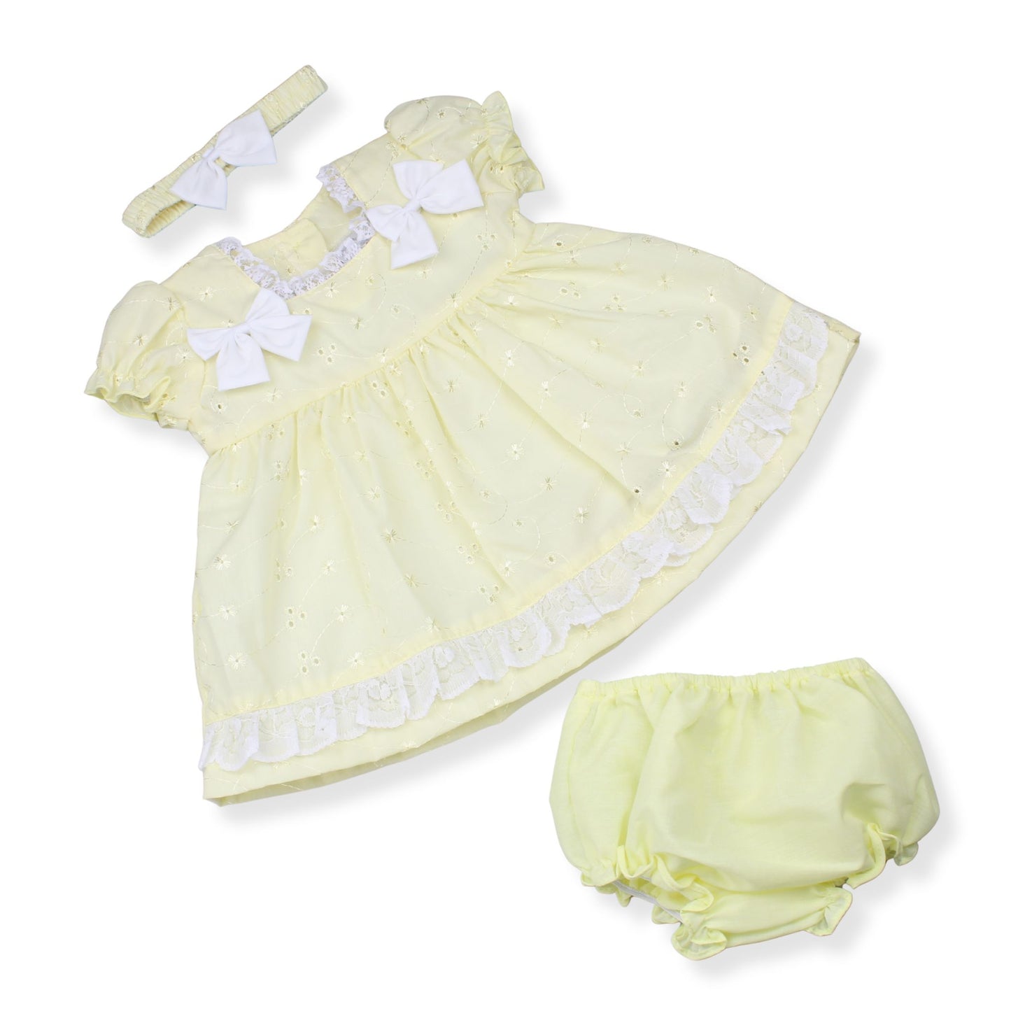 Yellow baby dress with matching headband and bloomers on a white background