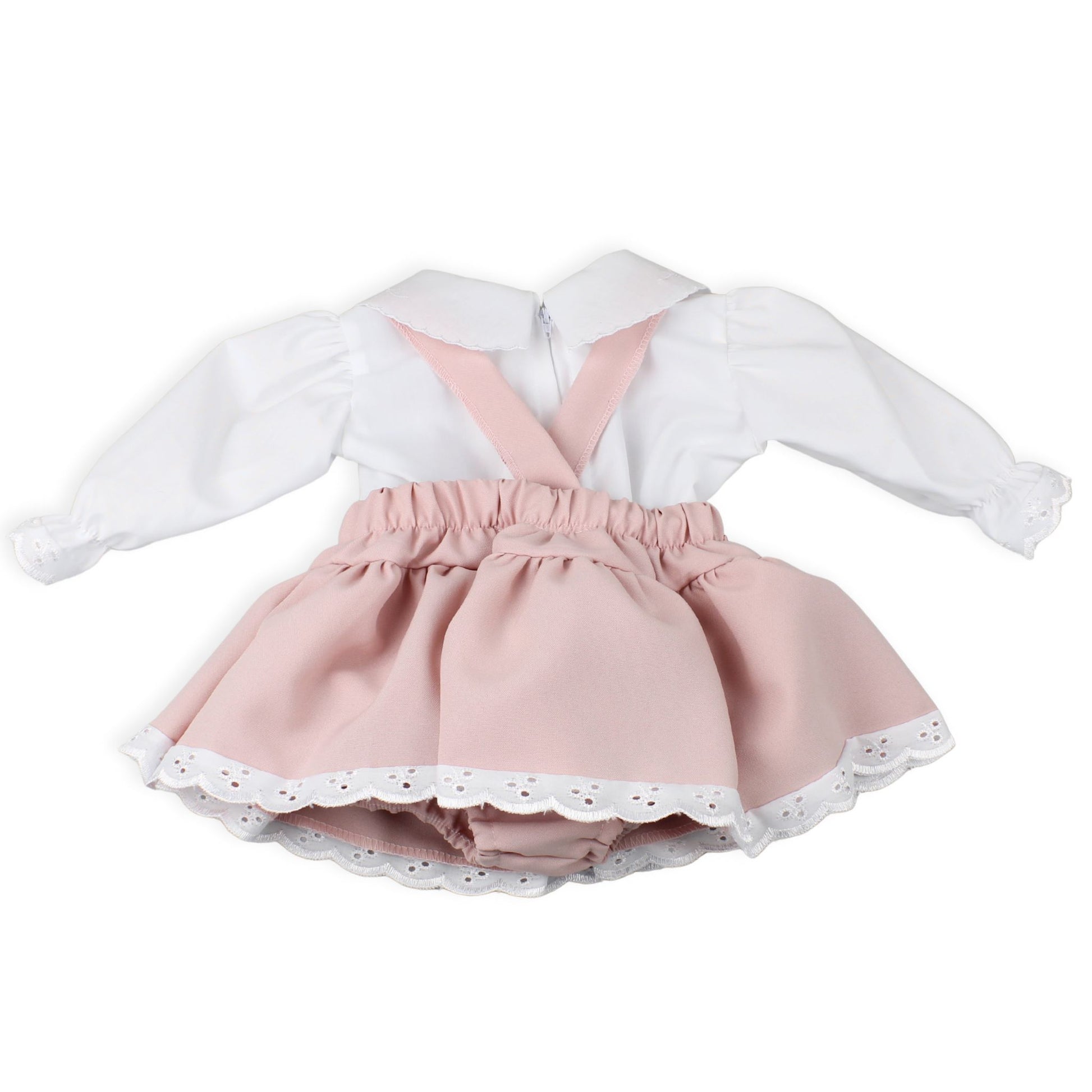 White blouse with pink suspenders and skirt on a white background