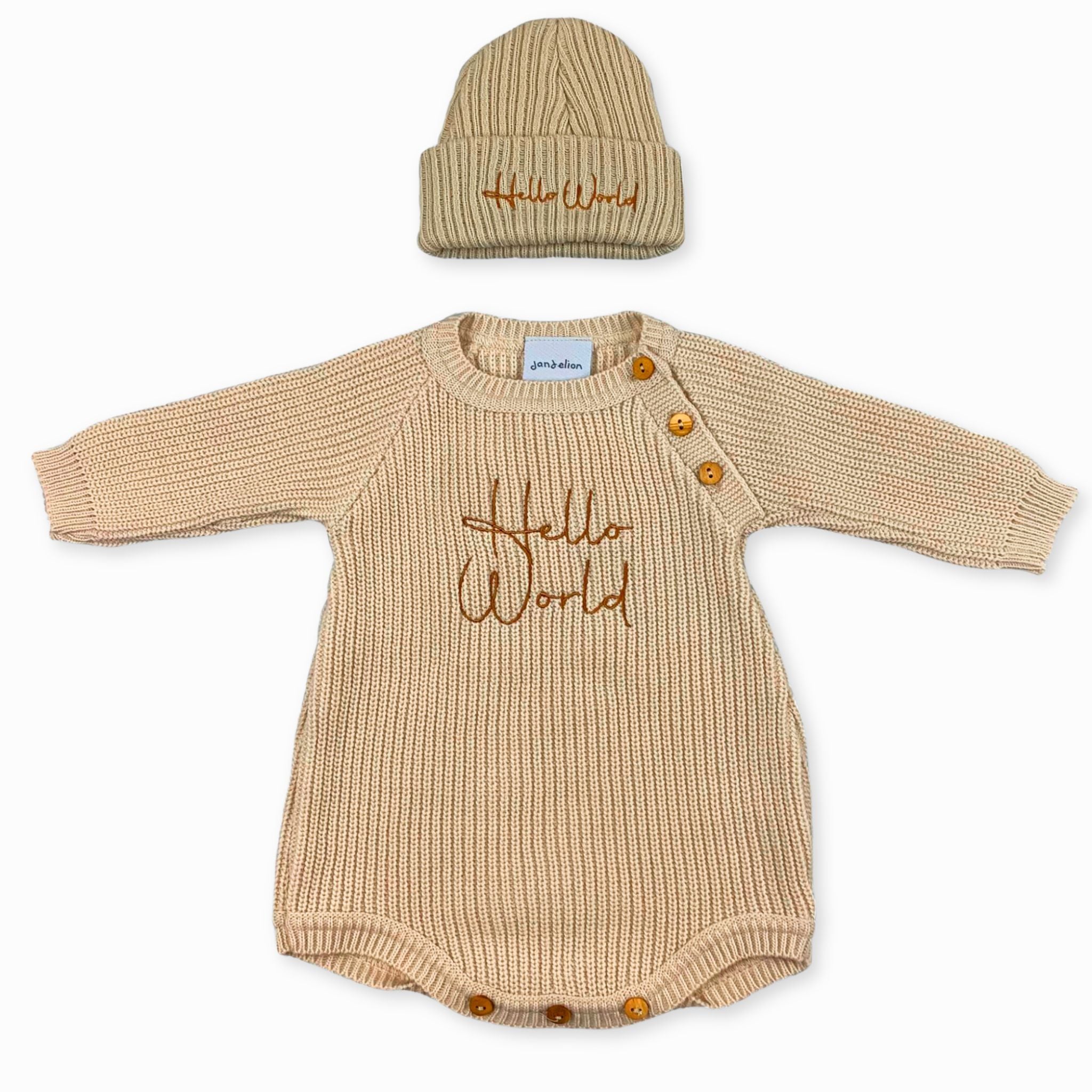 beige knitted baby outfi with hello world