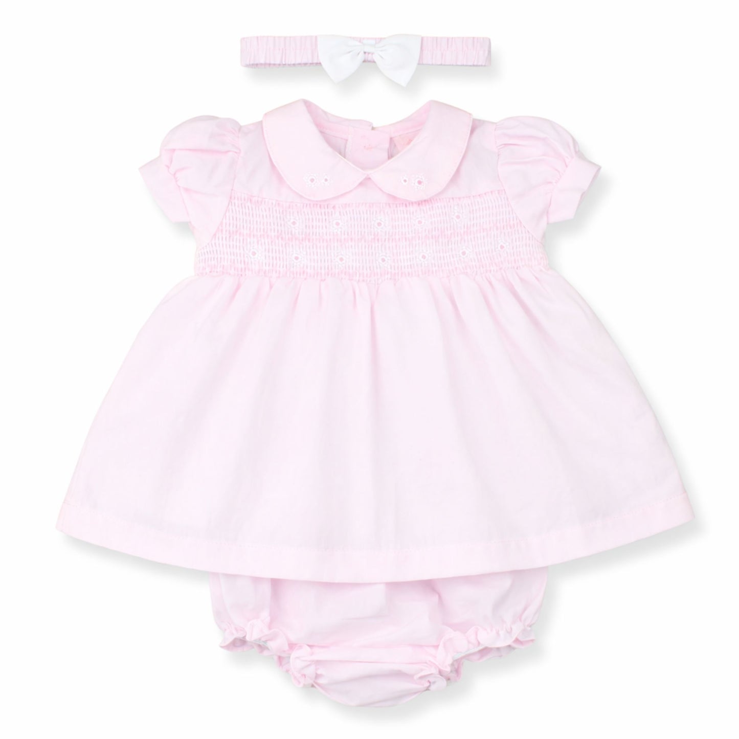 Pink baby dress with matching bloomers and headband on a white background