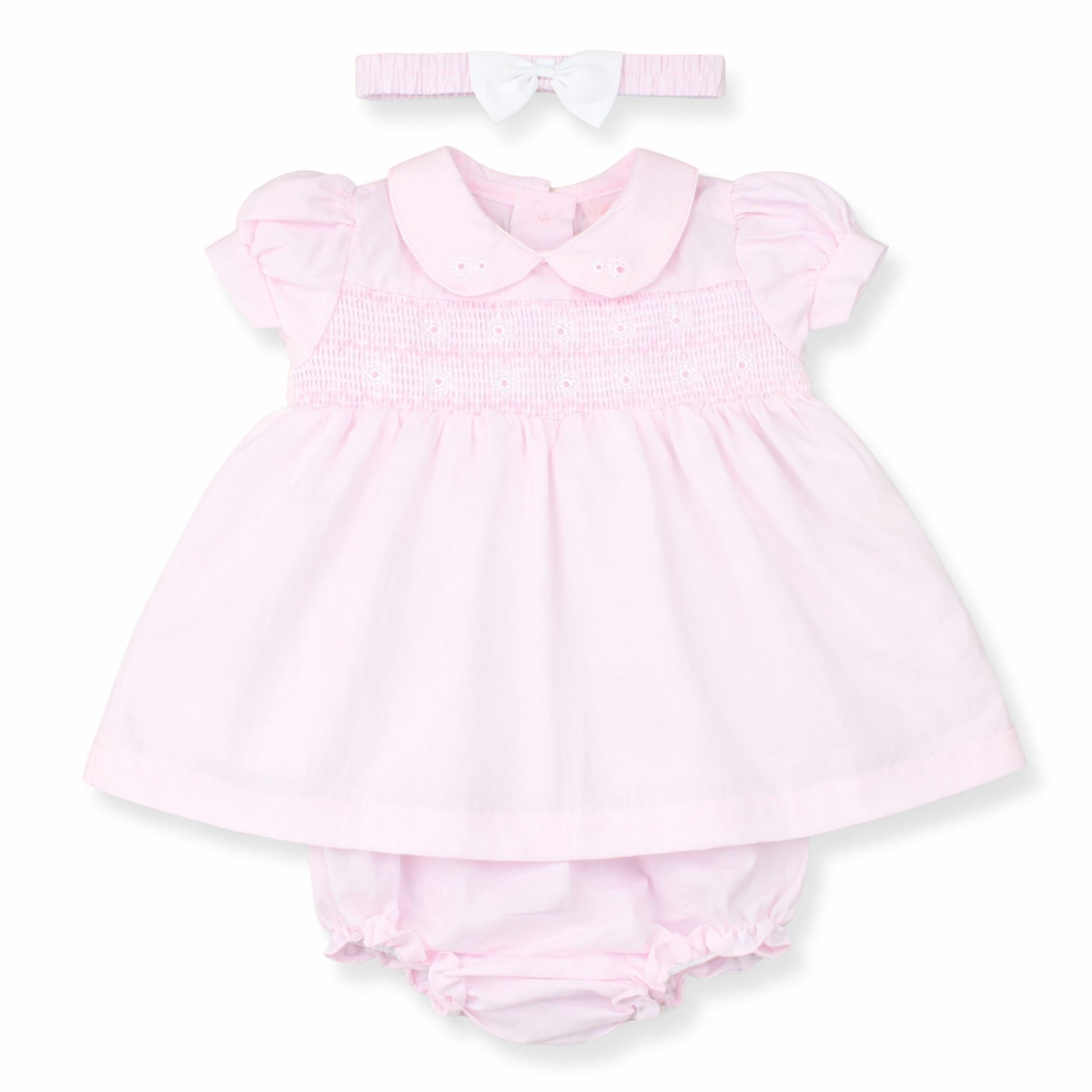 Pink baby dress with matching bloomers and headband on a white background