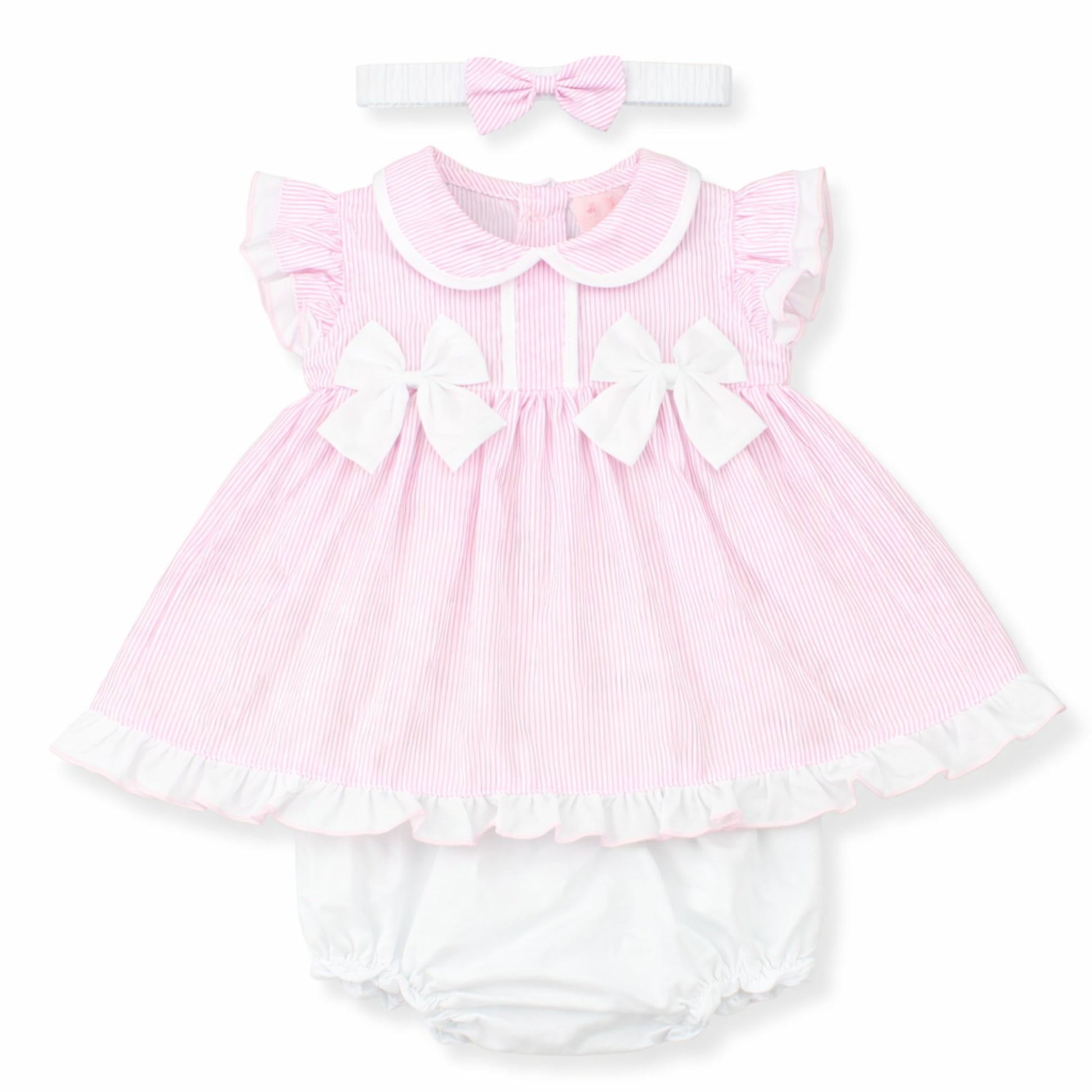 Pink baby dress with white ruffles and matching headband on a white background