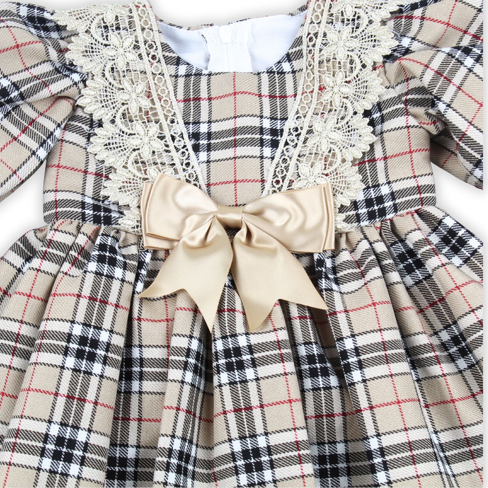 Plaid dress with lace details and a bow on a white background
