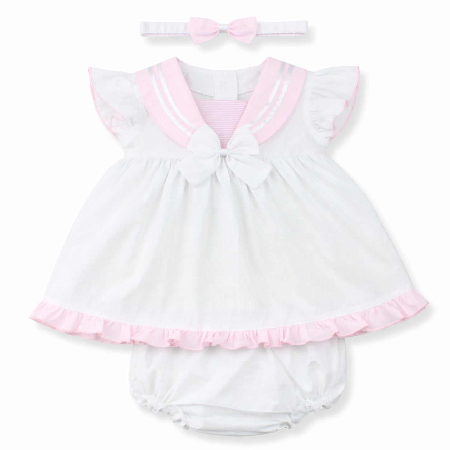 White baby dress with pink trim and matching headband on a white background