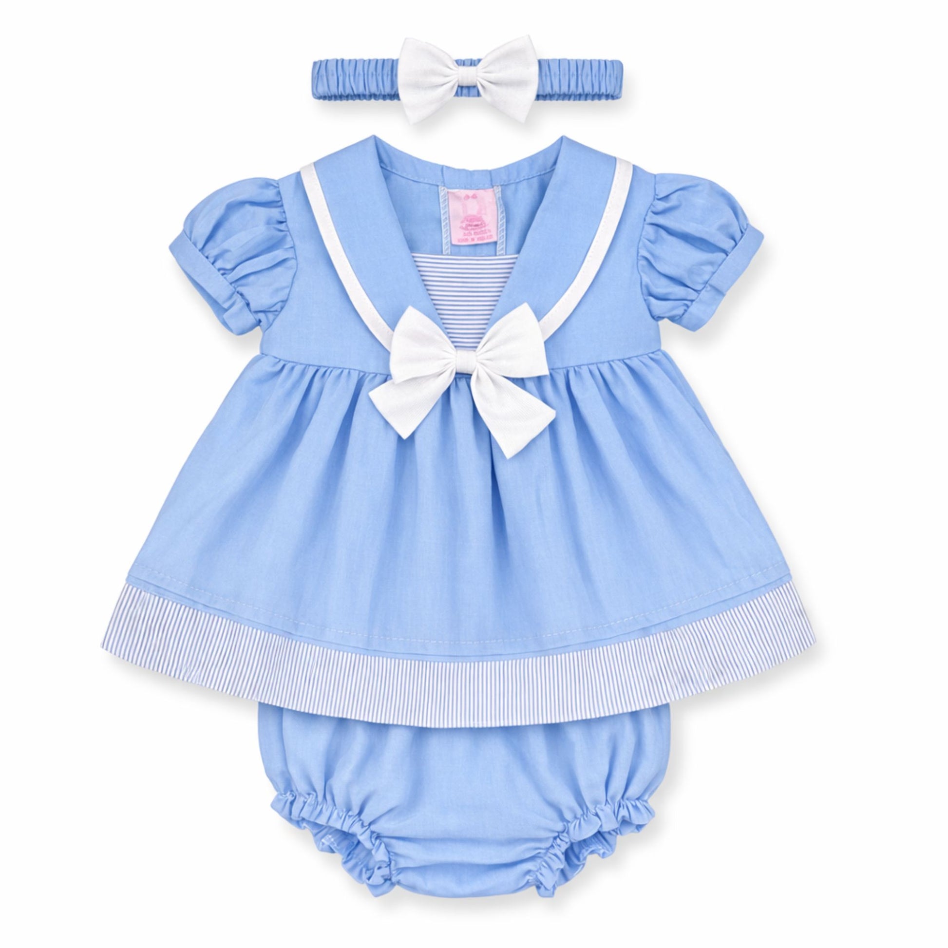 Blue baby dress with white bow, matching headband, and bloomers on a white background