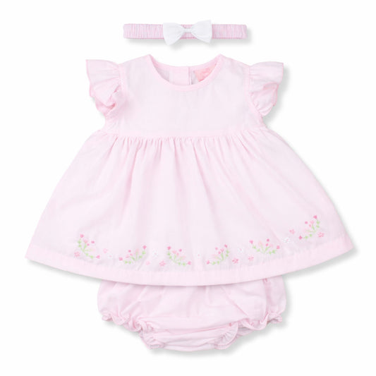 Pink baby dress with ruffled sleeves, matching bloomers, and headband on a white background