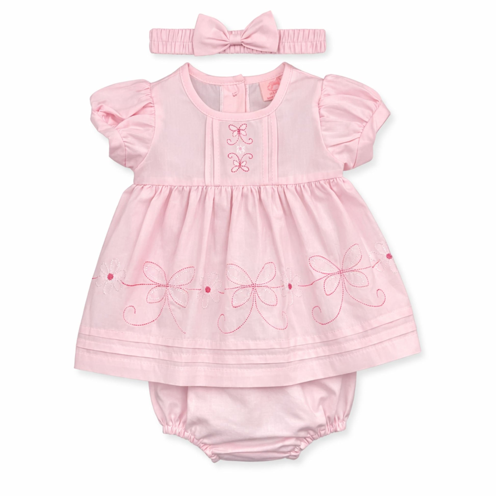 Pink baby dress with ruffles, embroidered details, and matching headband on a white background