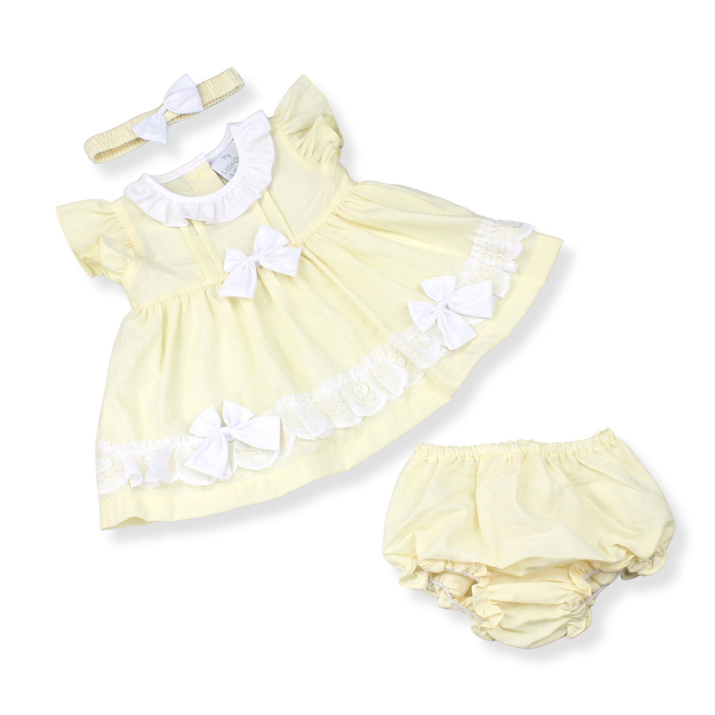 Yellow baby dress with white bows, matching headband, and bloomers on a white background