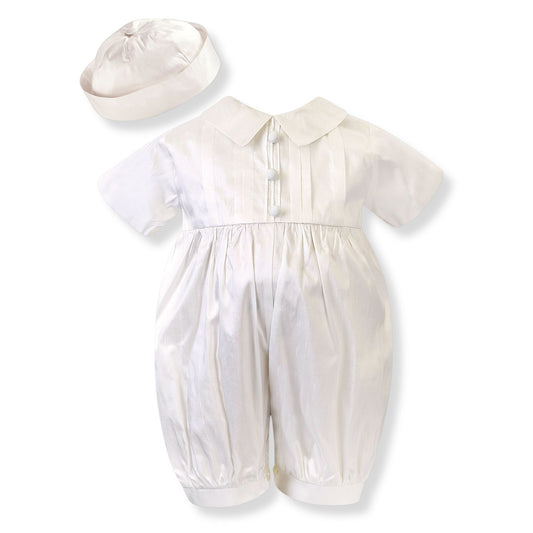 White baby romper with matching hat on a white background