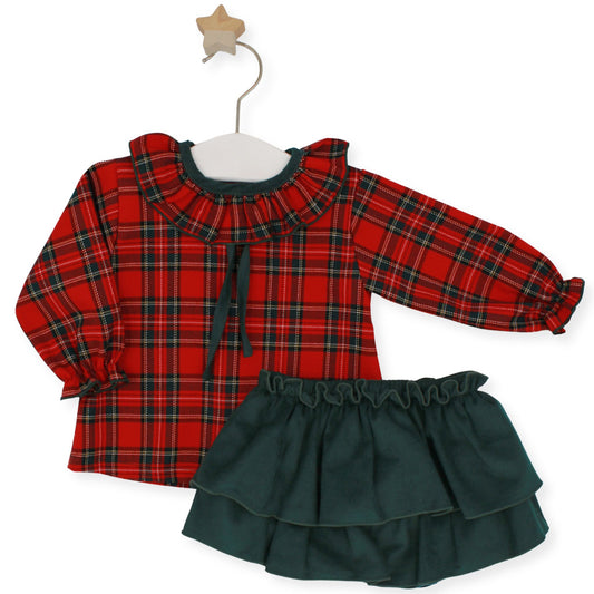 Red tartan long-sleeved blouse with green velvet tie and matching green corduroy tiered skirt by Rapife, displayed on hanger with star hook.